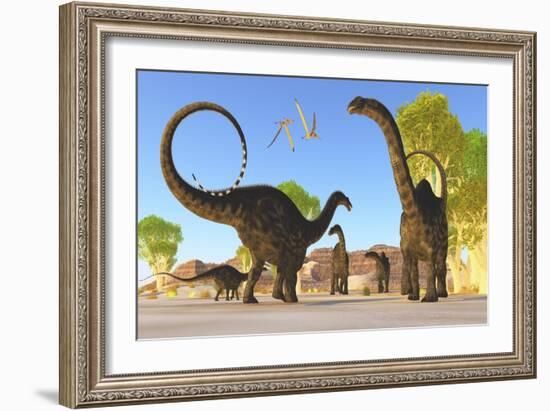 Herd of Apatosaurus Dinosaurs Wander Through a Prehistoric Forest-null-Framed Art Print