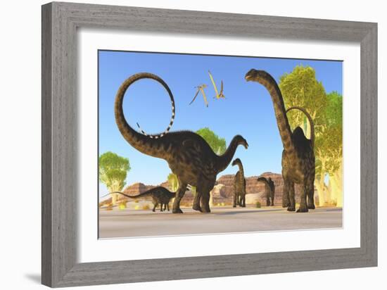 Herd of Apatosaurus Dinosaurs Wander Through a Prehistoric Forest-null-Framed Art Print