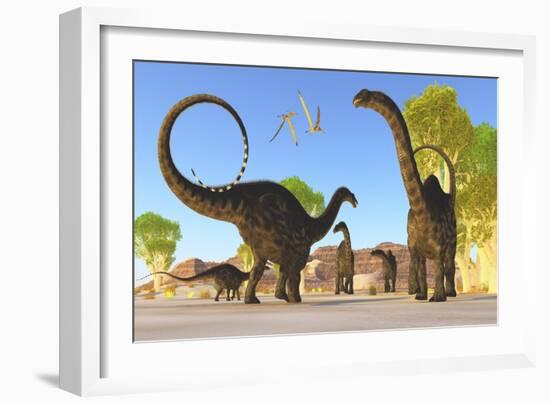 Herd of Apatosaurus Dinosaurs Wander Through a Prehistoric Forest-null-Framed Art Print