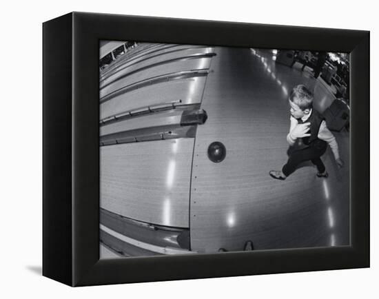 High Angle View of a Boy Bowling-null-Framed Premier Image Canvas