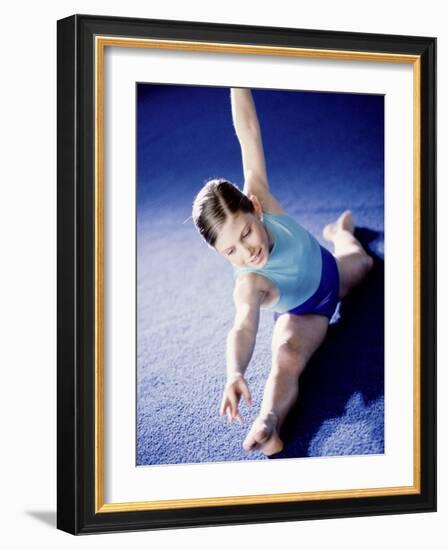 High Angle View of a Female Gymnast Stretching-null-Framed Photographic Print