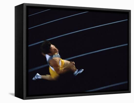 High Angle View of a Young Man Running on a Running Track-null-Framed Premier Image Canvas