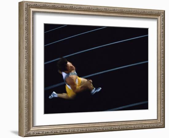 High Angle View of a Young Man Running on a Running Track-null-Framed Photographic Print