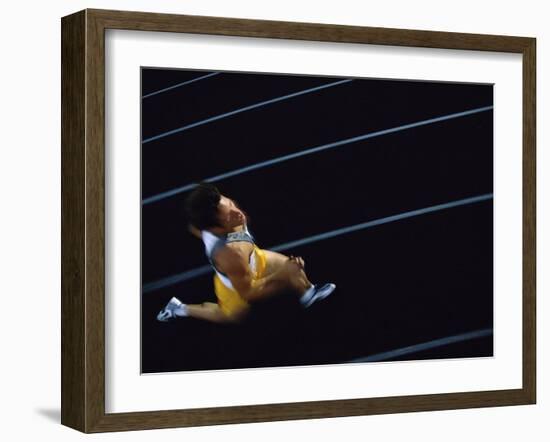 High Angle View of a Young Man Running on a Running Track-null-Framed Photographic Print