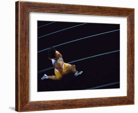 High Angle View of a Young Man Running on a Running Track-null-Framed Photographic Print