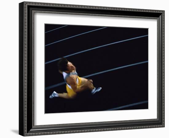 High Angle View of a Young Man Running on a Running Track-null-Framed Photographic Print