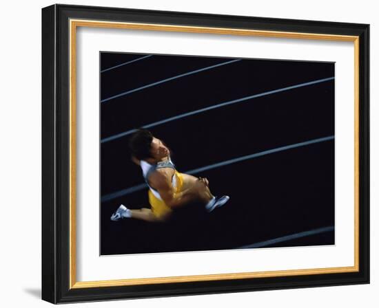 High Angle View of a Young Man Running on a Running Track-null-Framed Photographic Print