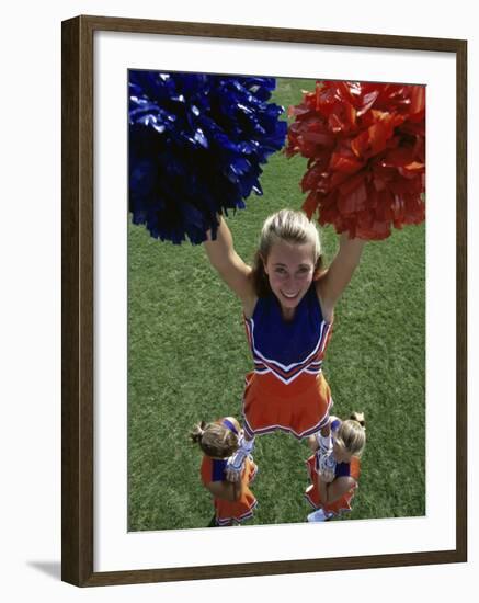 High Angle View of Cheerleaders Performing with Pom-Poms-null-Framed Photographic Print