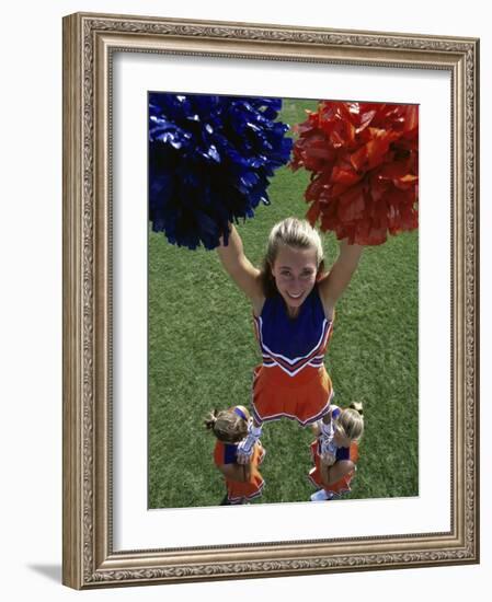 High Angle View of Cheerleaders Performing with Pom-Poms-null-Framed Photographic Print