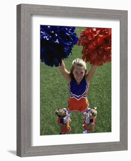 High Angle View of Cheerleaders Performing with Pom-Poms-null-Framed Photographic Print