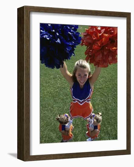 High Angle View of Cheerleaders Performing with Pom-Poms-null-Framed Photographic Print