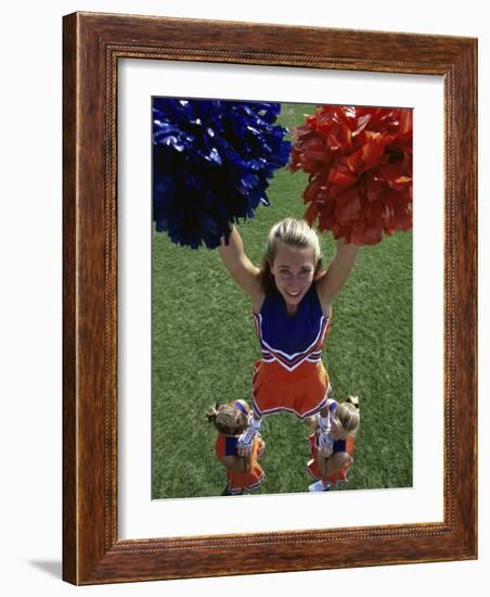 High Angle View of Cheerleaders Performing with Pom-Poms-null-Framed Photographic Print