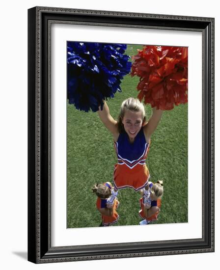 High Angle View of Cheerleaders Performing with Pom-Poms-null-Framed Photographic Print