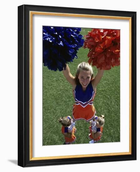 High Angle View of Cheerleaders Performing with Pom-Poms-null-Framed Photographic Print