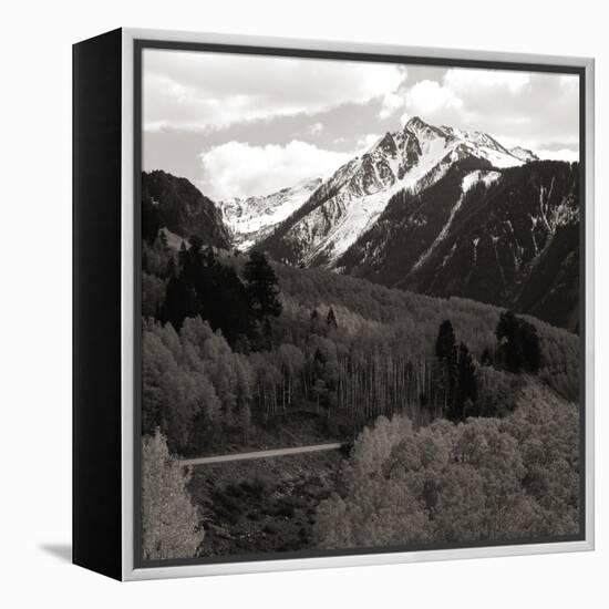 High angle view of road winding up the side of a hill with mountains in the distance-null-Framed Premier Image Canvas