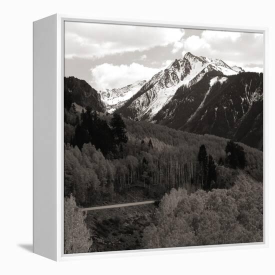 High angle view of road winding up the side of a hill with mountains in the distance-null-Framed Premier Image Canvas