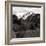 High angle view of road winding up the side of a hill with mountains in the distance-null-Framed Photographic Print