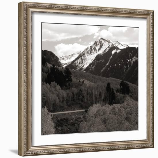 High angle view of road winding up the side of a hill with mountains in the distance-null-Framed Photographic Print