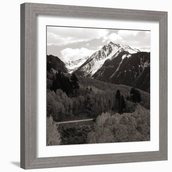 High angle view of road winding up the side of a hill with mountains in the distance-null-Framed Photographic Print