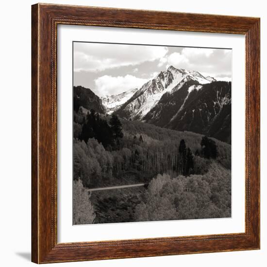 High angle view of road winding up the side of a hill with mountains in the distance-null-Framed Photographic Print