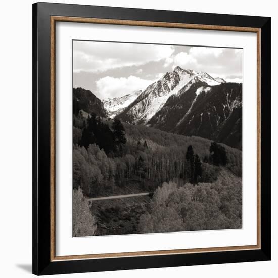 High angle view of road winding up the side of a hill with mountains in the distance-null-Framed Photographic Print