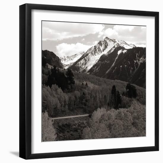 High angle view of road winding up the side of a hill with mountains in the distance-null-Framed Photographic Print