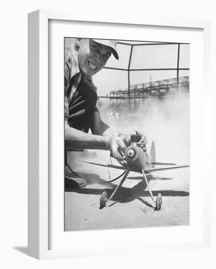 High School Student Holding His Model Plane Before Takeoff-Ed Clark-Framed Photographic Print