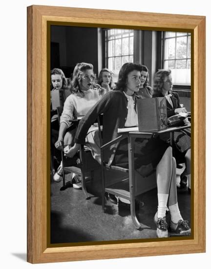 High School Student Passing Note to Classmate Sitting Behind Her-Nina Leen-Framed Premier Image Canvas