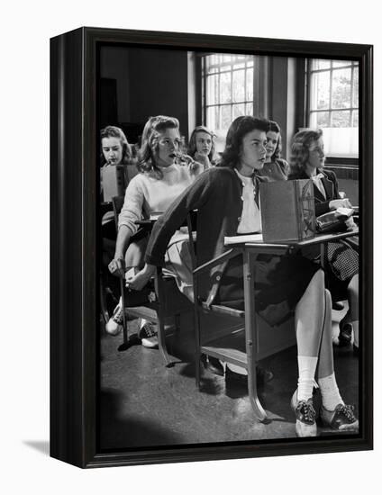 High School Student Passing Note to Classmate Sitting Behind Her-Nina Leen-Framed Premier Image Canvas