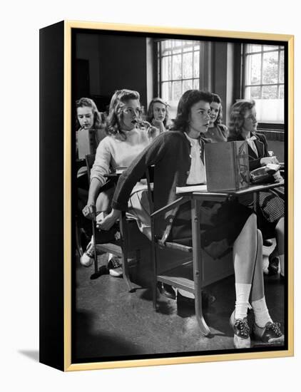 High School Student Passing Note to Classmate Sitting Behind Her-Nina Leen-Framed Premier Image Canvas