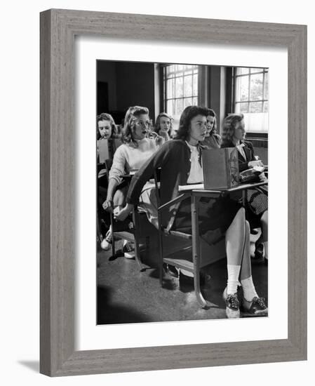 High School Student Passing Note to Classmate Sitting Behind Her-Nina Leen-Framed Photographic Print