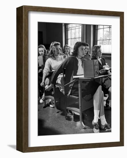 High School Student Passing Note to Classmate Sitting Behind Her-Nina Leen-Framed Photographic Print