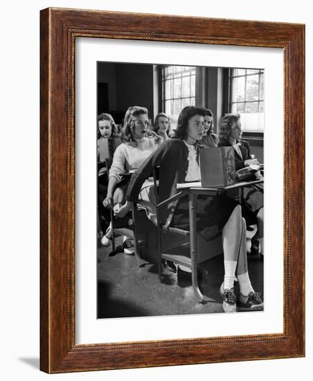 High School Student Passing Note to Classmate Sitting Behind Her-Nina Leen-Framed Photographic Print