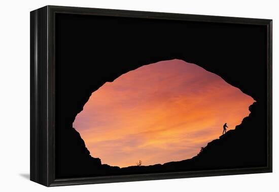 Hiker Climbing a Natural Arch in Utah-null-Framed Premier Image Canvas