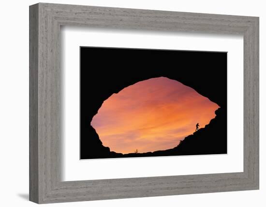 Hiker Climbing a Natural Arch in Utah-null-Framed Photographic Print