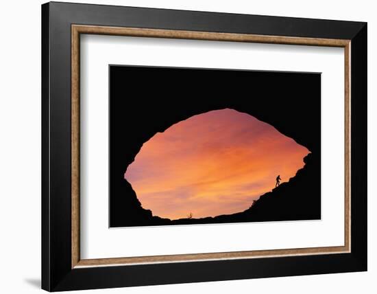 Hiker Climbing a Natural Arch in Utah-null-Framed Photographic Print