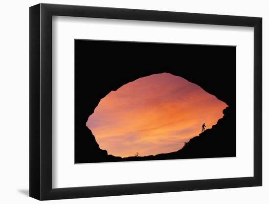 Hiker Climbing a Natural Arch in Utah-null-Framed Photographic Print