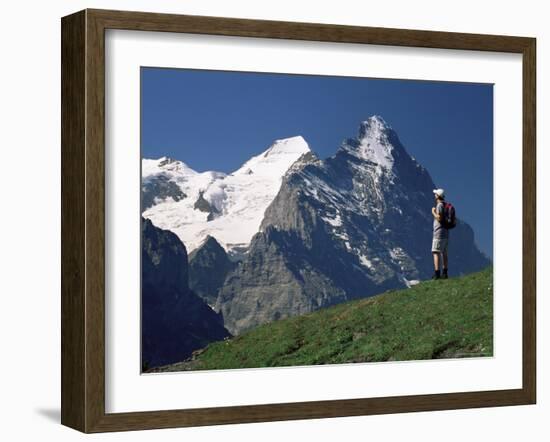 Hiker Looking to the Snow-Covered Monch and the North Face of the Eiger, Swiss Alps, Switzerland-Ruth Tomlinson-Framed Photographic Print