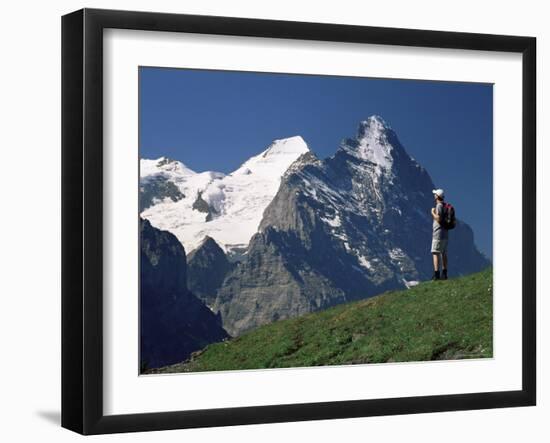 Hiker Looking to the Snow-Covered Monch and the North Face of the Eiger, Swiss Alps, Switzerland-Ruth Tomlinson-Framed Photographic Print