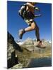 Hiker Running on Trail Above Lake at Schwarzee Paradise, Zermatt Alpine Resort, Valais, Switzerland-Christian Kober-Mounted Photographic Print