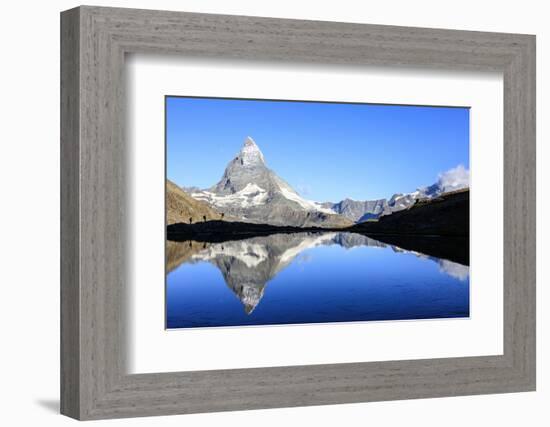 Hikers Admiring the Matterhorn Reflected in Lake Stellisee, Swiss Alps-Roberto Moiola-Framed Photographic Print