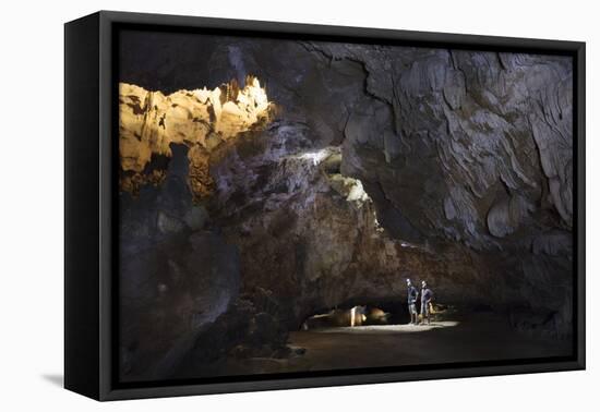 Hikers in the interior of Galaxy cave on the Ben Dang River in Thien Ha, Ninh Binh, Vietnam, Indoch-Alex Robinson-Framed Premier Image Canvas