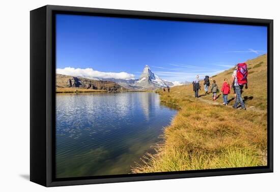 Hikers Walking on the Path Beside the Stellisee with the Matterhorn Reflected-Roberto Moiola-Framed Premier Image Canvas