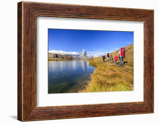 Hikers Walking on the Path Beside the Stellisee with the Matterhorn Reflected-Roberto Moiola-Framed Photographic Print