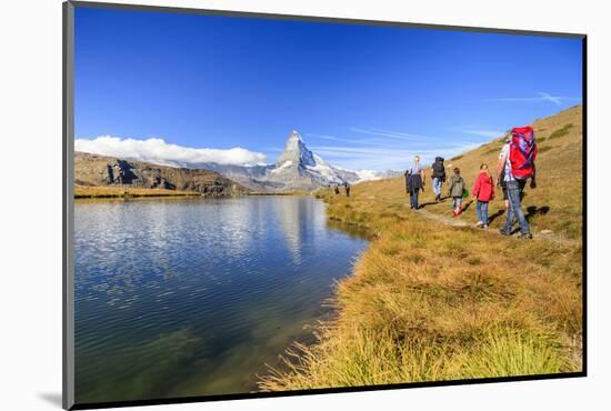 Hikers Walking on the Path Beside the Stellisee with the Matterhorn Reflected-Roberto Moiola-Mounted Photographic Print