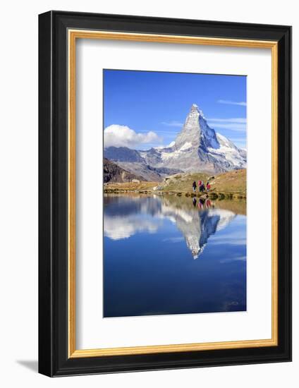 Hikers Walking on the Path Beside the Stellisee with the Matterhorn Reflected-Roberto Moiola-Framed Photographic Print