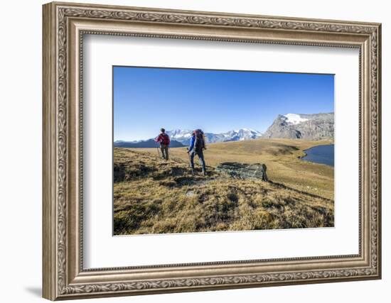 Hikers Wallking Along Rosset Lake, Gran Paradiso National Park, Alpi Graie (Graian Alps), Italy-Roberto Moiola-Framed Photographic Print