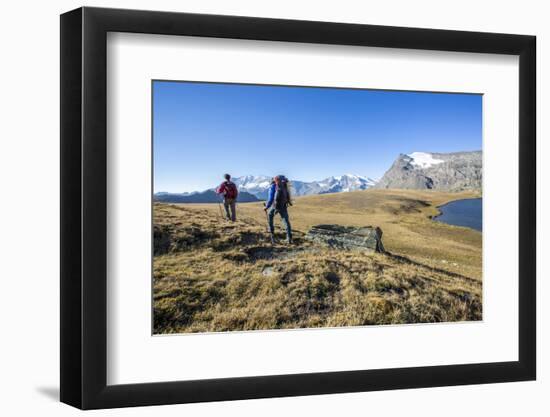 Hikers Wallking Along Rosset Lake, Gran Paradiso National Park, Alpi Graie (Graian Alps), Italy-Roberto Moiola-Framed Photographic Print