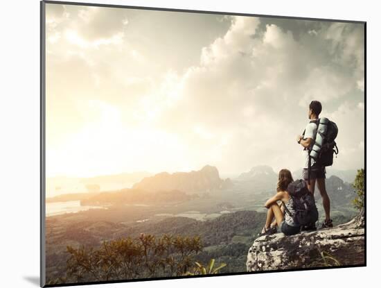 Hikers With Backpacks Enjoying Valley View From Top Of A Mountain-Dudarev Mikhail-Mounted Art Print