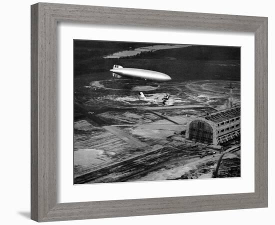 Hindenburg's Arrival with an Escort Plane over Lakehurst, New Jersey-null-Framed Photo